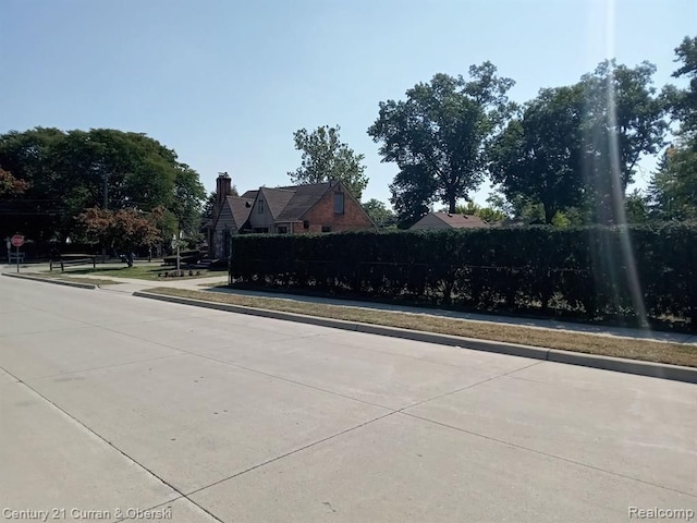 view of road featuring sidewalks and curbs