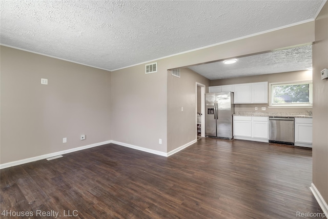 6291 Edmund St, Romulus, MI 48174 - unfurnished living room with dark wood finished floors, a textured ceiling, and ornamental molding