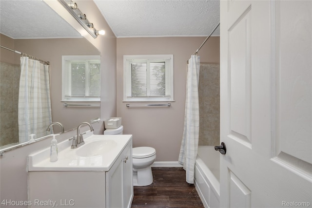 6291 Edmund St, Romulus, MI 48174 - bathroom with vanity, wood finished floors, a textured ceiling, and shower / tub combo with curtain