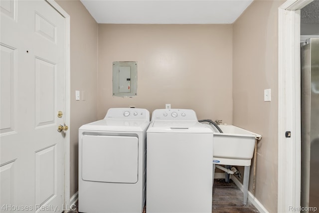 6291 Edmund St, Romulus, MI 48174 - laundry area featuring electric panel, independent washer and dryer, and dark wood finished floors