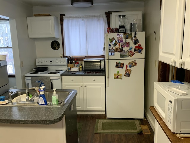 kitchen with white appliances, dark wood-style flooring, dark countertops, and white cabinetry