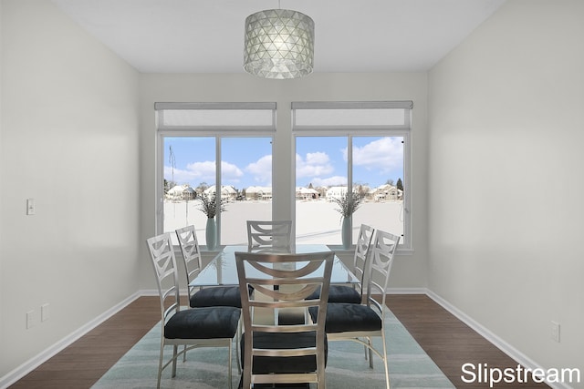 dining space featuring a healthy amount of sunlight, baseboards, and dark wood-style flooring