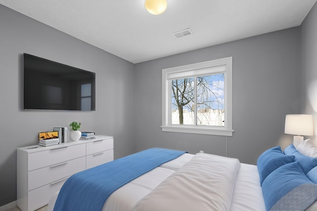 bedroom featuring visible vents