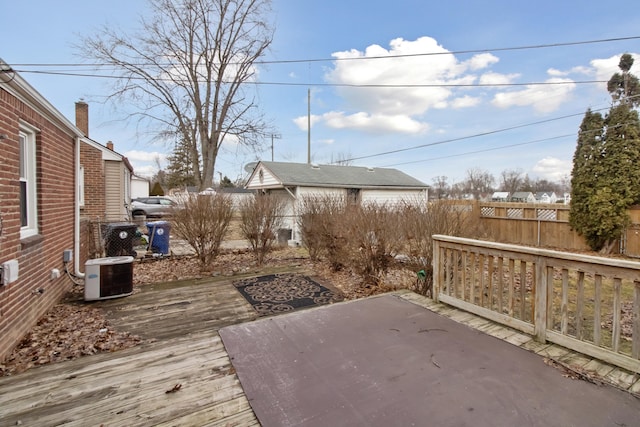 deck with central air condition unit and fence