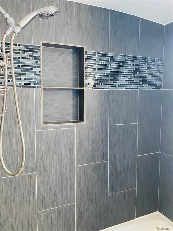 exterior details featuring tiled shower