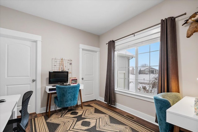 home office featuring baseboards and dark wood-style flooring