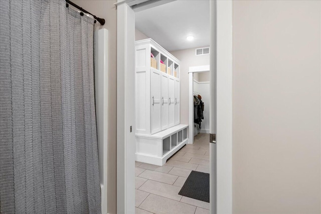 mudroom featuring light tile patterned floors and visible vents