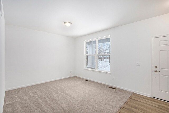 72180 Van Dyke, Bruce, MI 48065 - unfurnished room featuring baseboards and wood finished floors
