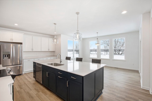 72180 Van Dyke, Bruce, MI 48065 - kitchen with stainless steel appliances, a sink, white cabinetry, light countertops, and recessed lighting