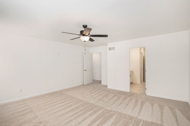 72180 Van Dyke, Bruce, MI 48065 - unfurnished bedroom featuring light colored carpet, baseboards, a ceiling fan, and connected bathroom
