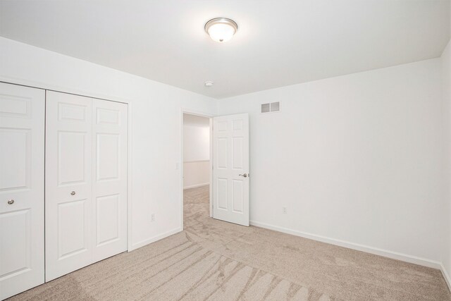 72180 Van Dyke, Bruce, MI 48065 - unfurnished bedroom with carpet, a closet, and baseboards