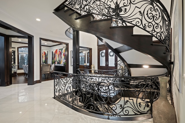 details featuring ornamental molding and french doors