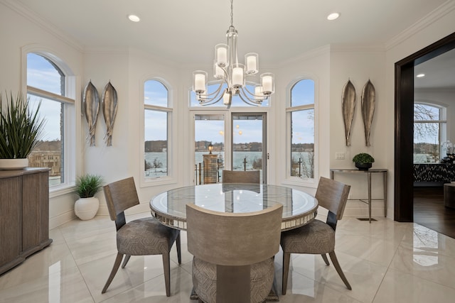 dining area with baseboards, ornamental molding, recessed lighting, and a notable chandelier