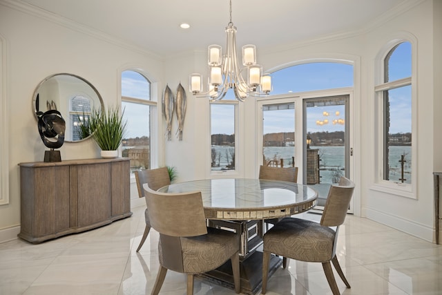 dining space featuring ornamental molding, recessed lighting, baseboards, and an inviting chandelier