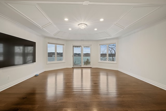 unfurnished living room with ornamental molding, wood finished floors, and baseboards