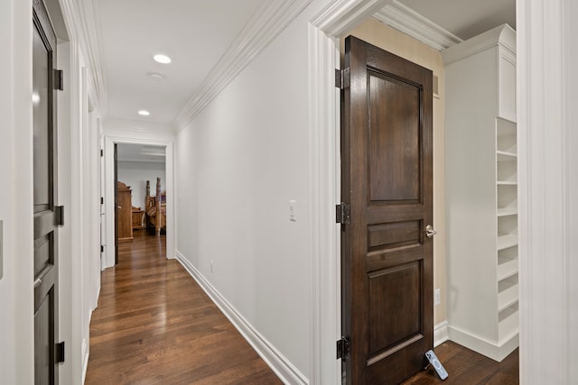 hall featuring ornamental molding, recessed lighting, dark wood finished floors, and baseboards