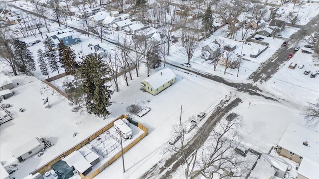 snowy aerial view featuring a residential view