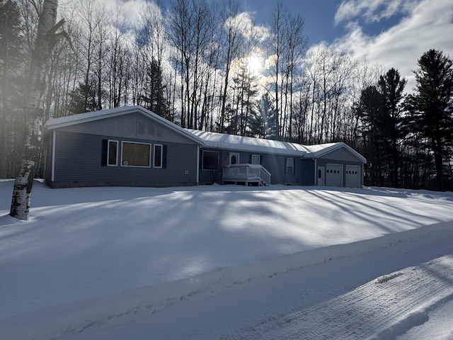 single story home featuring an attached garage