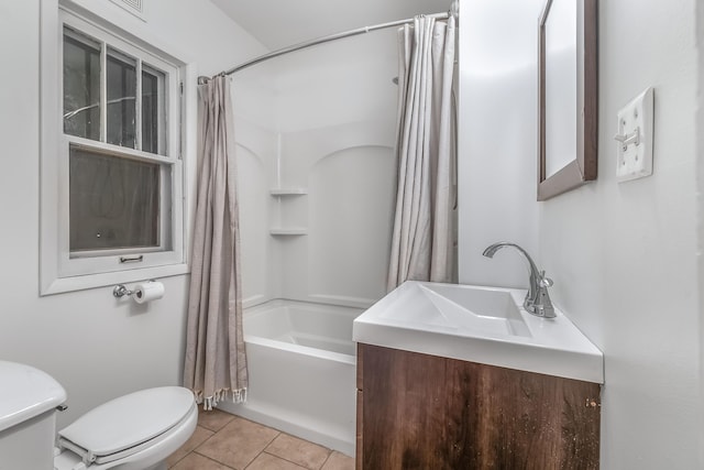 bathroom with toilet, tile patterned flooring, shower / bath combination with curtain, and vanity