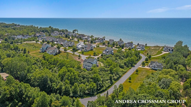 birds eye view of property featuring a residential view and a water view