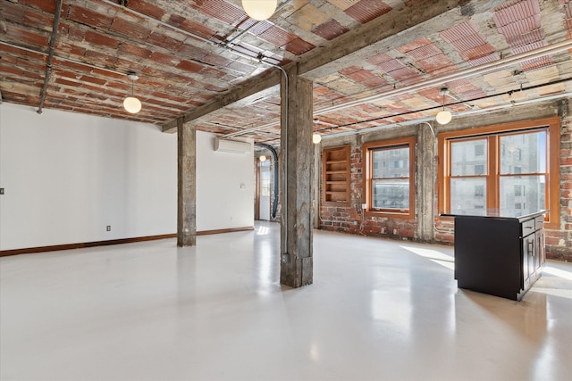 78 Watson St Unit 13, Detroit, MI 48201 - basement with an AC wall unit and baseboards