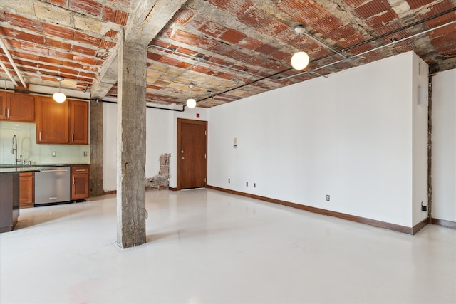 78 Watson St Unit 13, Detroit, MI 48201 - unfurnished living room with baseboards, a sink, and finished concrete floors