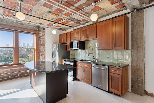 78 Watson St Unit 13, Detroit, MI 48201 - kitchen featuring concrete floors, appliances with stainless steel finishes, and brown cabinetry