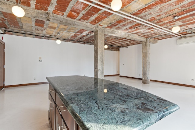 78 Watson St Unit 13, Detroit, MI 48201 - below grade area with a wall mounted air conditioner and baseboards