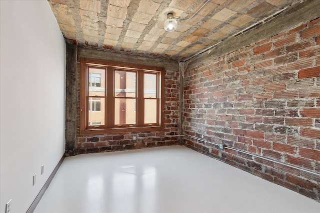 78 Watson St Unit 13, Detroit, MI 48201 - empty room with brick wall and finished concrete floors