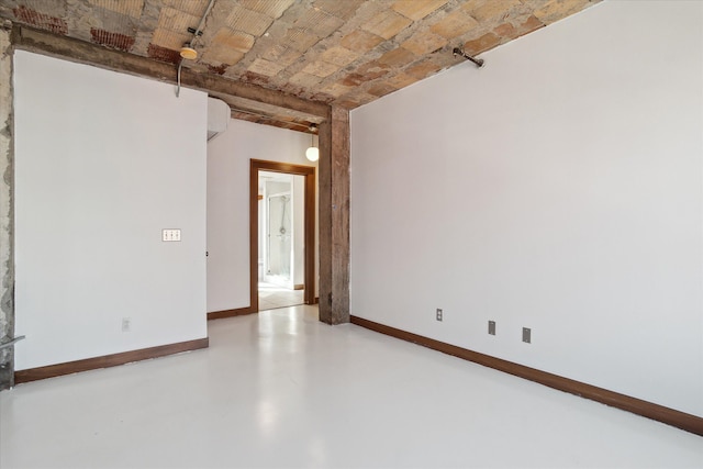 78 Watson St Unit 13, Detroit, MI 48201 - spare room featuring brick ceiling, concrete floors, and baseboards