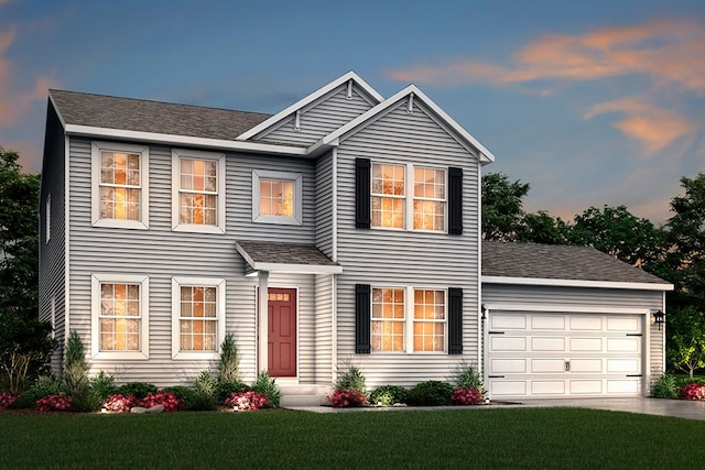 view of front of house with a front yard, roof with shingles, driveway, and an attached garage