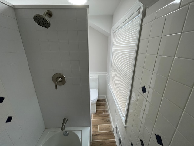 full bathroom with visible vents, toilet, and wood tiled floor