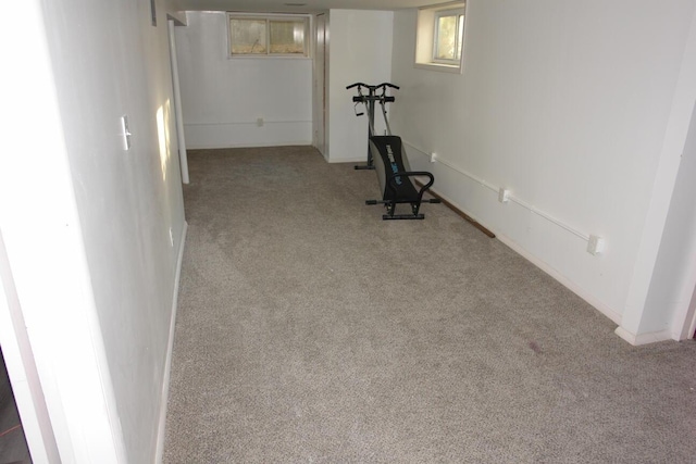 workout room featuring light colored carpet