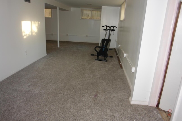 exercise area featuring light carpet and visible vents