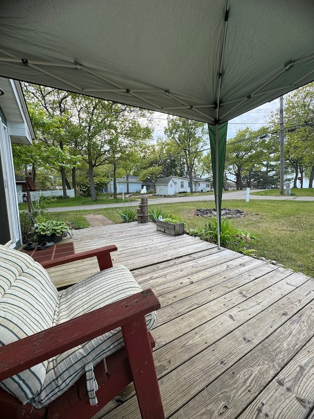 wooden terrace with a yard