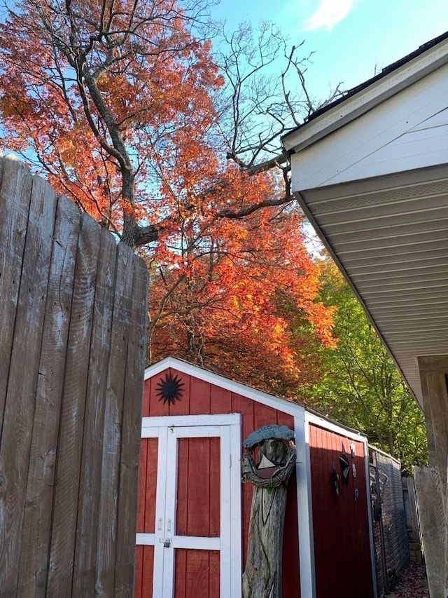 view of shed with fence