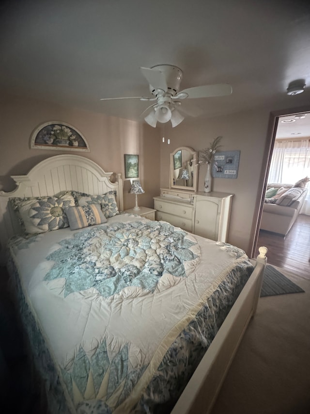 bedroom featuring wood finished floors and ceiling fan