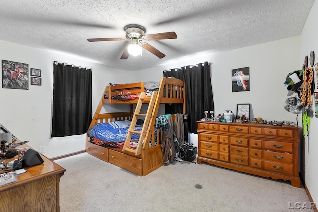 bedroom with light carpet, a textured ceiling, and a ceiling fan