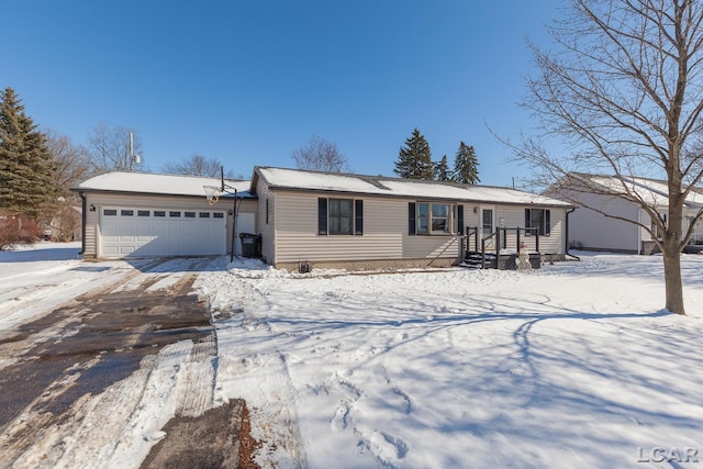 view of front of home with a garage and driveway