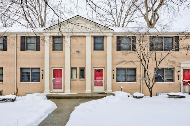 view of property with brick siding