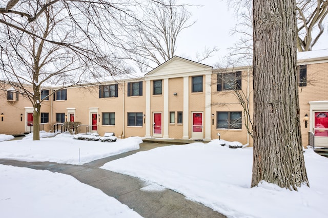 townhome / multi-family property with brick siding