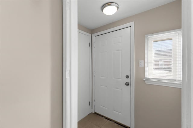 doorway featuring light tile patterned floors