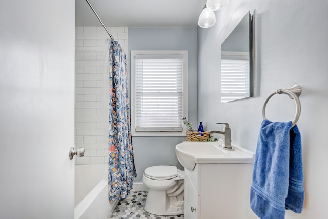 bathroom with toilet, vanity, and shower / tub combo with curtain