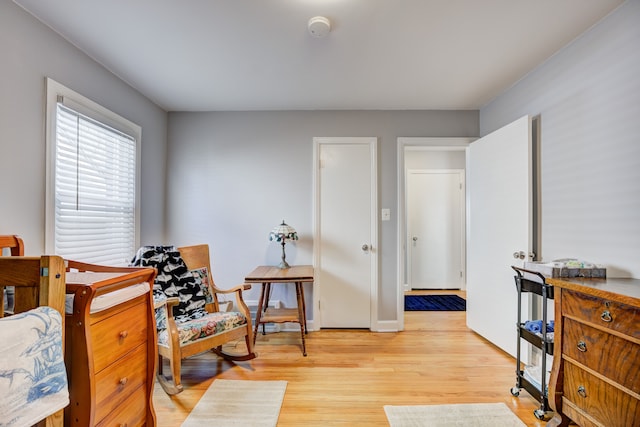 sitting room with light wood-style floors and baseboards