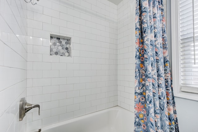 full bathroom with shower / tub combo with curtain