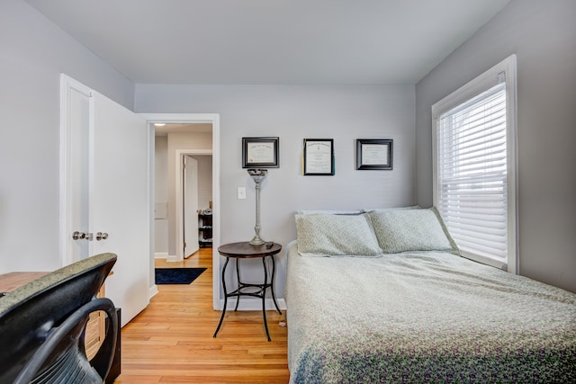 bedroom featuring wood finished floors