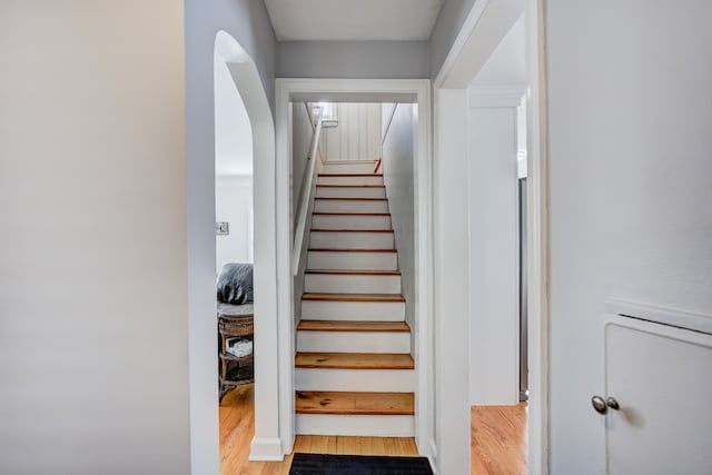 stairway featuring wood finished floors