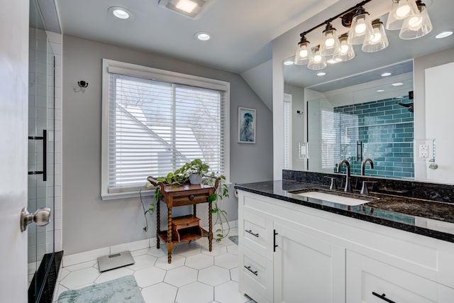 bathroom with recessed lighting, vanity, visible vents, baseboards, and a stall shower