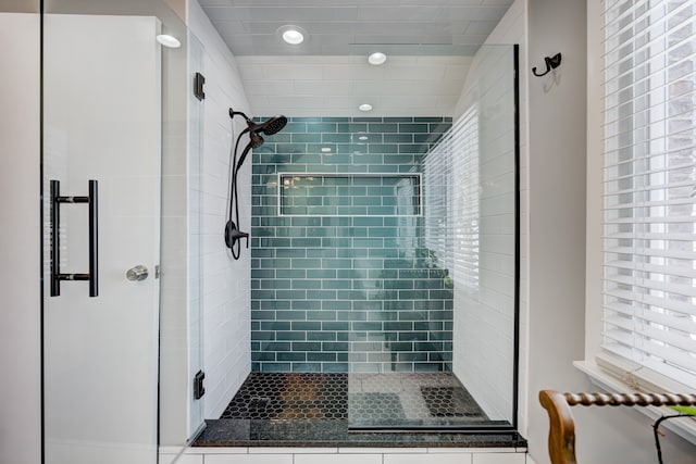 bathroom featuring a stall shower and recessed lighting