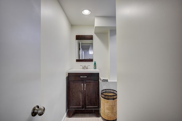 bathroom featuring vanity and baseboards